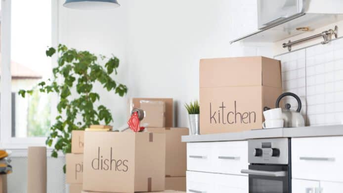 moving boxes sitting on a kitchen counter ready to be backed